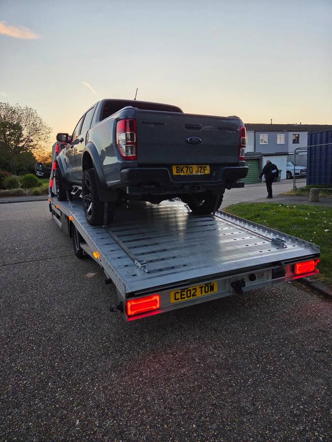 Ford Ranger pickup truck loaded on Tow 2 Tow recovery truck flatbed
