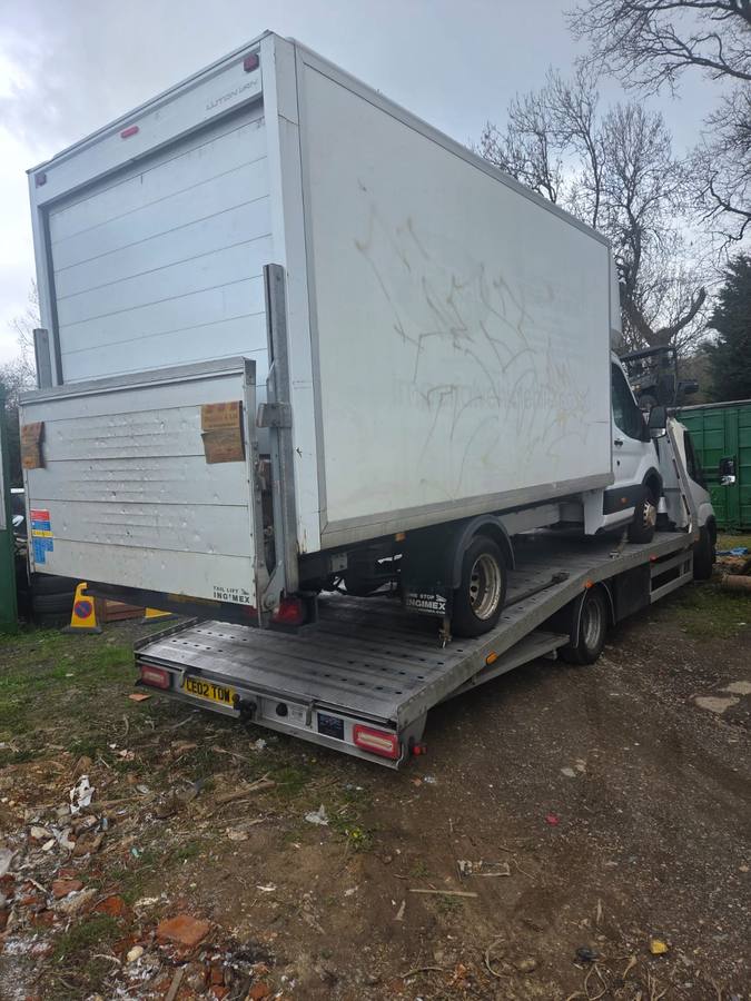 Large white refrigerated box truck loaded on Tow 2 Tow recovery flatbed